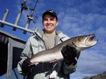 Gary holds Austin's 10 LB. bull trout from a recent guide trip